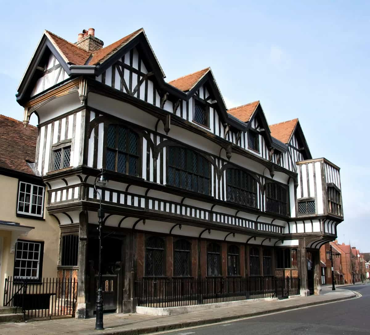 large tudor property on a street